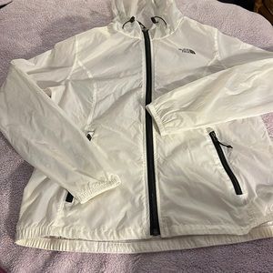The North Face white w/ black lining windbreaker.
